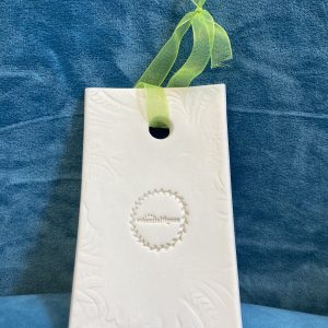 Ceramic rectangle with green handing ribbon to diffuse oils from