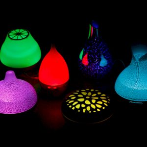 Aroma Diffusers light up different colours on a black back ground