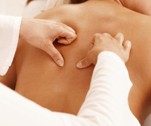 A persona receiving a back massage to demonstrate how Essential Thyme can help relieve back pain.